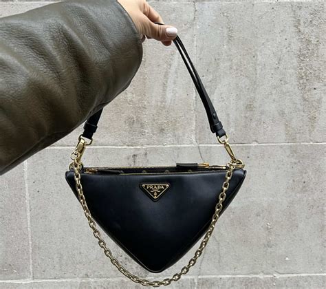 prada triangle gold bag|prada symbole bag.